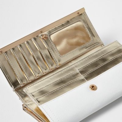 White metallic panel foldover clip top purse